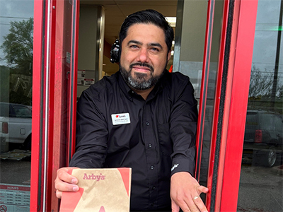 Cleveland, TX Arby's manager, Nestor Martinez, in the drive-thru.