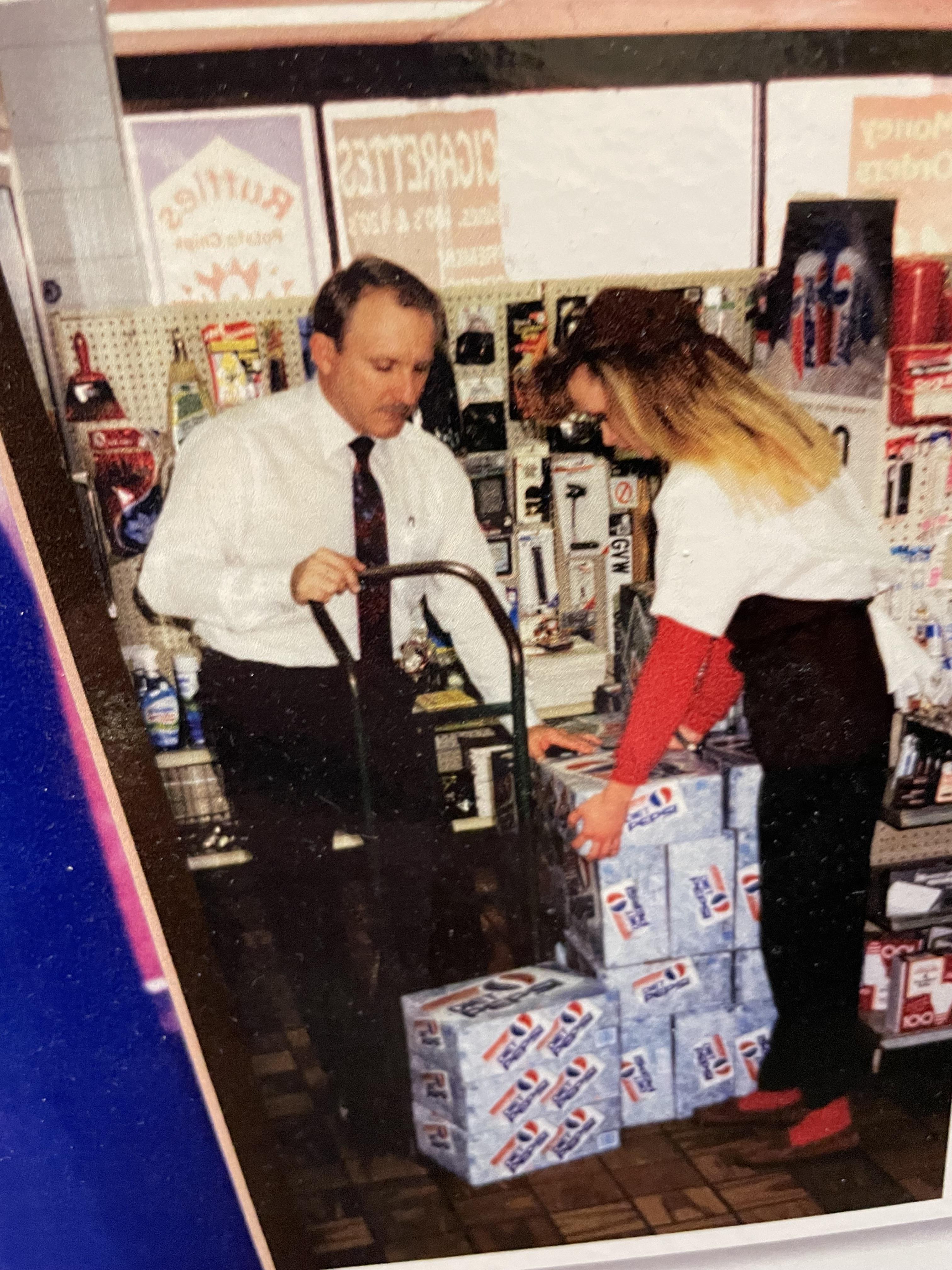 Harold Wells helping stock beverages at a Love's