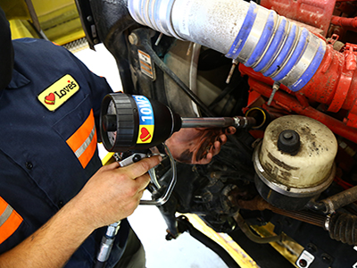 loves truck care mechanic preforming love premium oil change