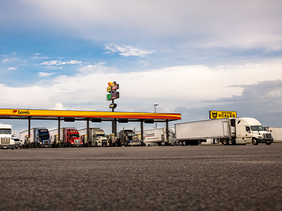 commercial trucks fueling at Love's Travel Stops during daytime at diesel bays