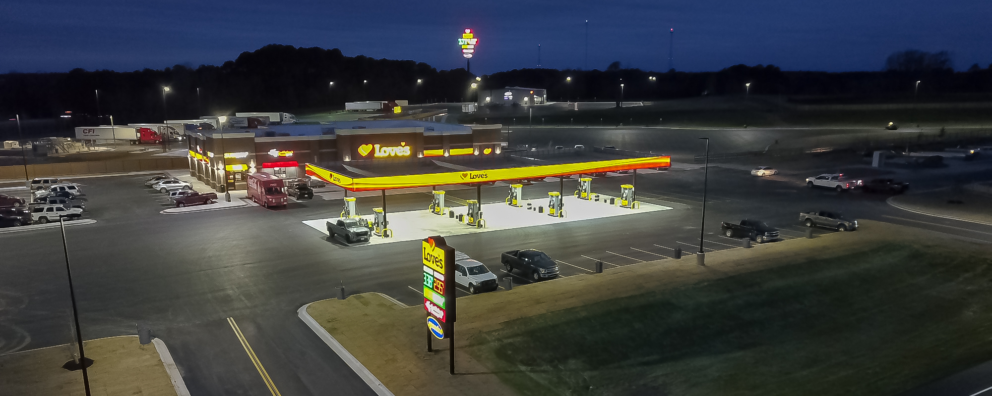 loves travel stop with gas pumps at night time in Winona Texas