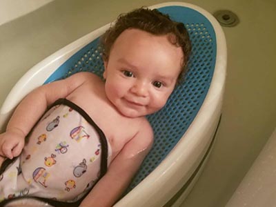 infant baby getting a bath