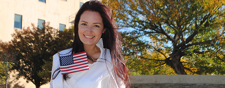 Love's employee Violeta Bingham holding American flag