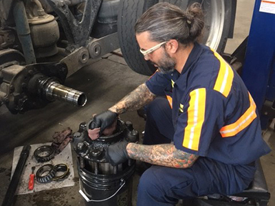 Love's Truck Care mechanic, Cameron Barnett, working in his shop in Waddy, Kentucky. 
