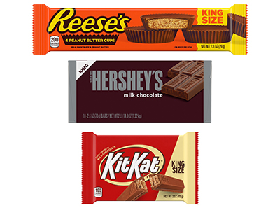A trio of king size candy bars: Reese's PB cups, Kit Kat and Hershey's milk chocolate