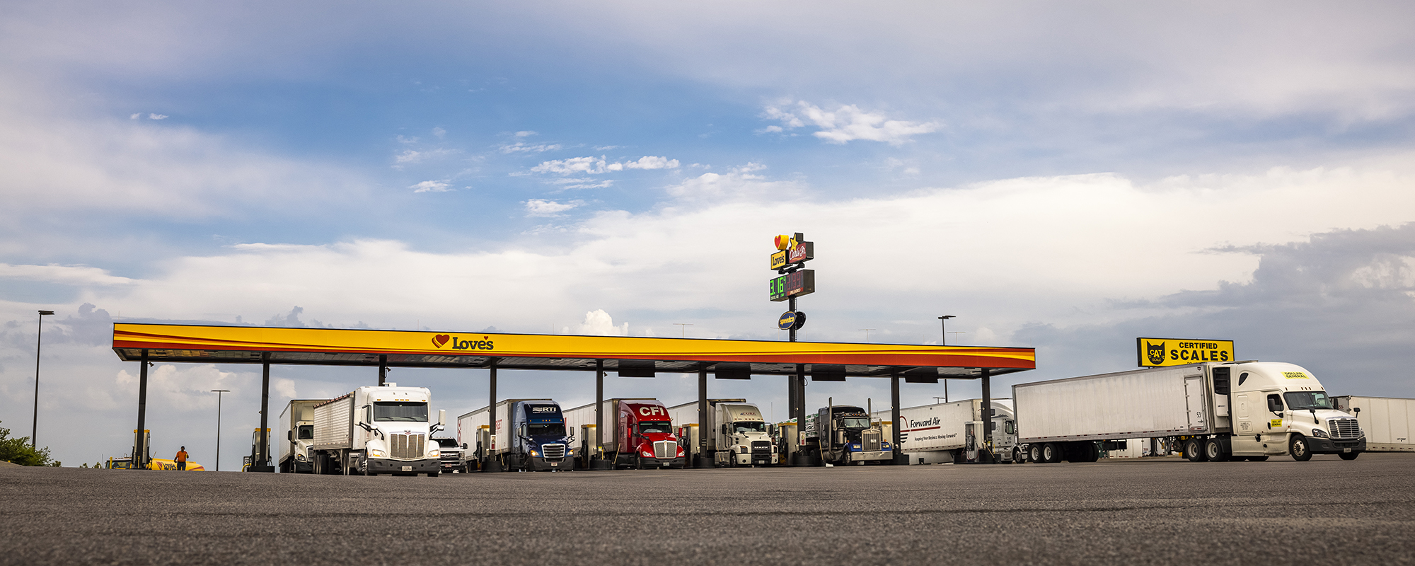 A photo of trucks fueling in a diesel bay at a Love's Travel Stops